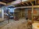 Unfinished basement with exposed beams and concrete floors at 1074 25Th Ne St, Hickory, NC 28601