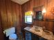 Bathroom featuring paneled walls, stone counter, and patterned floors at 1074 25Th Ne St, Hickory, NC 28601