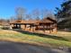 Charming brick home with a covered carport, second story balcony, and a well-maintained lawn at 1074 25Th Ne St, Hickory, NC 28601