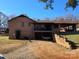 Back exterior of brick home with a covered carport and balcony at 1074 25Th Ne St, Hickory, NC 28601