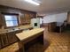 Bright kitchen with wood cabinets, island, white appliances, and wood flooring at 1074 25Th Ne St, Hickory, NC 28601