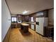 Spacious kitchen featuring an island, wood cabinets, and white appliances at 1074 25Th Ne St, Hickory, NC 28601