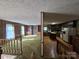 View from stairs into the living room and kitchen at 1074 25Th Ne St, Hickory, NC 28601