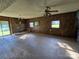 Spacious living room featuring stone fireplace and sliding door access at 1074 25Th Ne St, Hickory, NC 28601