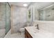 Bathroom featuring marble tile and a glass enclosed tub and shower combo at 109 Arabian Ln, Salisbury, NC 28147
