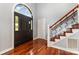 Elegant foyer with hardwood floors, staircase, and arched front door at 109 Arabian Ln, Salisbury, NC 28147