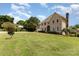 Spacious front yard with lush green grass surrounds this brick two-story house at 109 Arabian Ln, Salisbury, NC 28147