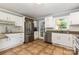 Bright kitchen featuring stainless steel appliances, granite countertops, and ample white cabinetry at 109 Arabian Ln, Salisbury, NC 28147