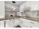 Well-lit kitchen area with granite countertop and view into the living room at 109 Arabian Ln, Salisbury, NC 28147