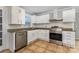 Modern kitchen with stainless steel appliances and white cabinets at 109 Arabian Ln, Salisbury, NC 28147
