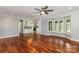Open living room with hardwood floors and bay window is adjacent to the kitchen at 109 Arabian Ln, Salisbury, NC 28147