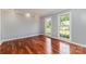 Bright living room featuring hardwood floors, large windows, and neutral paint at 109 Arabian Ln, Salisbury, NC 28147