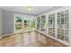 Sun room with tile floors and lots of windows overlook the backyard at 109 Arabian Ln, Salisbury, NC 28147