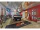 Finished basement features concrete flooring, corrugated metal ceilings, and a pool table in a recreational space at 110 Lakeland Rd # 19, Mooresville, NC 28117