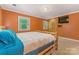 Bedroom featuring a log bed frame and built-in storage space, great for organizing belongings at 110 Lakeland Rd # 19, Mooresville, NC 28117