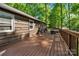 Spacious wooden deck with railing, perfect for outdoor entertaining or relaxation amid lush greenery at 110 Lakeland Rd # 19, Mooresville, NC 28117