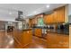 Well-equipped kitchen featuring stainless steel appliances, granite countertops, and wooden cabinets at 110 Lakeland Rd # 19, Mooresville, NC 28117