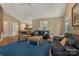 Comfortable living room with hardwood floors, cozy seating, and backyard views at 110 Lakeland Rd # 19, Mooresville, NC 28117