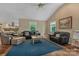 Relaxing living room featuring hardwood floors, comfortable seating and bright windows at 110 Lakeland Rd # 19, Mooresville, NC 28117