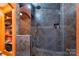 Walk-in shower tiled with dark stone-look tile, multiple shower heads and a built-in niche at 110 Lakeland Rd # 19, Mooresville, NC 28117