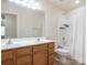 Bathroom features a double sink vanity with shower and toilet behind a partial wall at 12304 Lookout Point Dr, Charlotte, NC 28269