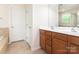 Bathroom with double sink vanity and separate commode and tub/shower room at 12304 Lookout Point Dr, Charlotte, NC 28269