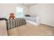 Cozy bedroom featuring two twin beds and a bright window, perfect for a room at 12304 Lookout Point Dr, Charlotte, NC 28269