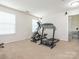 Spacious bonus room featuring an eliptical, treadmill, and home gym equipment, perfect for exercising at 12304 Lookout Point Dr, Charlotte, NC 28269