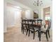 Elegant dining room featuring a chandelier, art and dark wood table perfect for Gathering dinners at 12304 Lookout Point Dr, Charlotte, NC 28269
