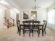Spacious dining area with a classic chandelier and easy access to the staircase at 12304 Lookout Point Dr, Charlotte, NC 28269