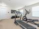 Spacious carpeted room with treadmill and elliptical, perfect for a home gym setup at 12304 Lookout Point Dr, Charlotte, NC 28269