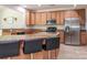 Well-equipped kitchen with a breakfast bar, granite counters, and stainless steel appliances at 12304 Lookout Point Dr, Charlotte, NC 28269