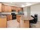 Spacious kitchen with granite countertops, stainless appliances and a breakfast bar area at 12304 Lookout Point Dr, Charlotte, NC 28269