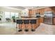Modern kitchen featuring a large island, granite countertops, and stainless steel appliances at 12304 Lookout Point Dr, Charlotte, NC 28269