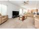 Spacious living room open to the kitchen, offering ample seating and natural light at 12304 Lookout Point Dr, Charlotte, NC 28269