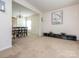 Open-concept living room and dining area with neutral tones and ample space at 12304 Lookout Point Dr, Charlotte, NC 28269