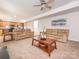 Open-concept living room and kitchen with comfortable seating and a seamless flow at 12304 Lookout Point Dr, Charlotte, NC 28269