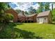 The spacious backyard showcases a deck and a storage shed at 1260 Piccadilly Dr, Charlotte, NC 28211