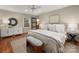 Serene bedroom with a comfortable bed, stylish bench, and a decorative mirror at 1260 Piccadilly Dr, Charlotte, NC 28211