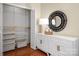 Walk-in closet with custom shelving, drawers, and a mirrored accent piece at 1260 Piccadilly Dr, Charlotte, NC 28211
