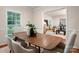 This dining room features stylish furnishings, hardwood floors, and bright natural light, ideal for Gathering gatherings at 1260 Piccadilly Dr, Charlotte, NC 28211