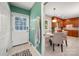 Entryway that provides access to a breakfast nook with seating and wood cabinets at 1260 Piccadilly Dr, Charlotte, NC 28211