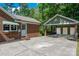 Charming brick home features a detached garage and ample parking space at 1260 Piccadilly Dr, Charlotte, NC 28211