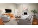 Cozy living room with a fireplace, comfortable seating, and hardwood floors perfect for relaxing at 1260 Piccadilly Dr, Charlotte, NC 28211
