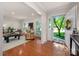 Bright living room with hardwood floors, white trim, and lots of natural light streaming through the windows at 1260 Piccadilly Dr, Charlotte, NC 28211
