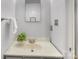 Bathroom with modern sink, vanity, and mirror, complimented by gray walls and fixtures at 1325 Rock Point Rd, Charlotte, NC 28270