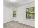 Bedroom with carpet, natural light, and white walls at 1325 Rock Point Rd, Charlotte, NC 28270