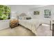 Bright bedroom with neutral carpet, a comfortable upholstered bed, and an airy feel at 1325 Rock Point Rd, Charlotte, NC 28270