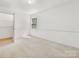 Neutral bedroom with closet and window with lots of natural light at 1325 Rock Point Rd, Charlotte, NC 28270