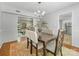 Charming dining room with stylish lighting, a dark wood table, and open views into a bright living space at 1325 Rock Point Rd, Charlotte, NC 28270